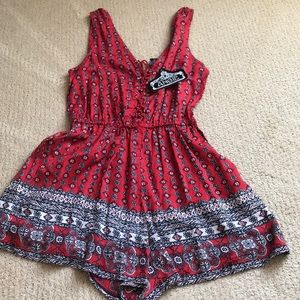 An adorable detailed red sassy romper.